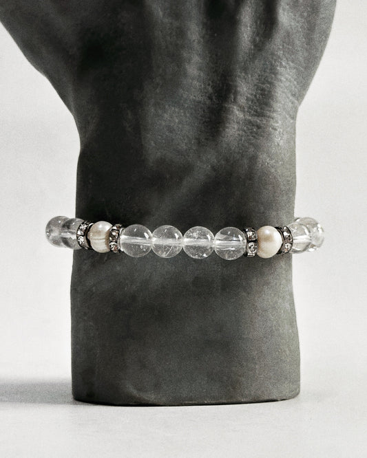 The CIRRUS®️ Quartz &amp; Pearl Bracelet features natural freshwater pearls and clear quartz strung with rhinestone-encrusted spacers in a gunmetal finish.