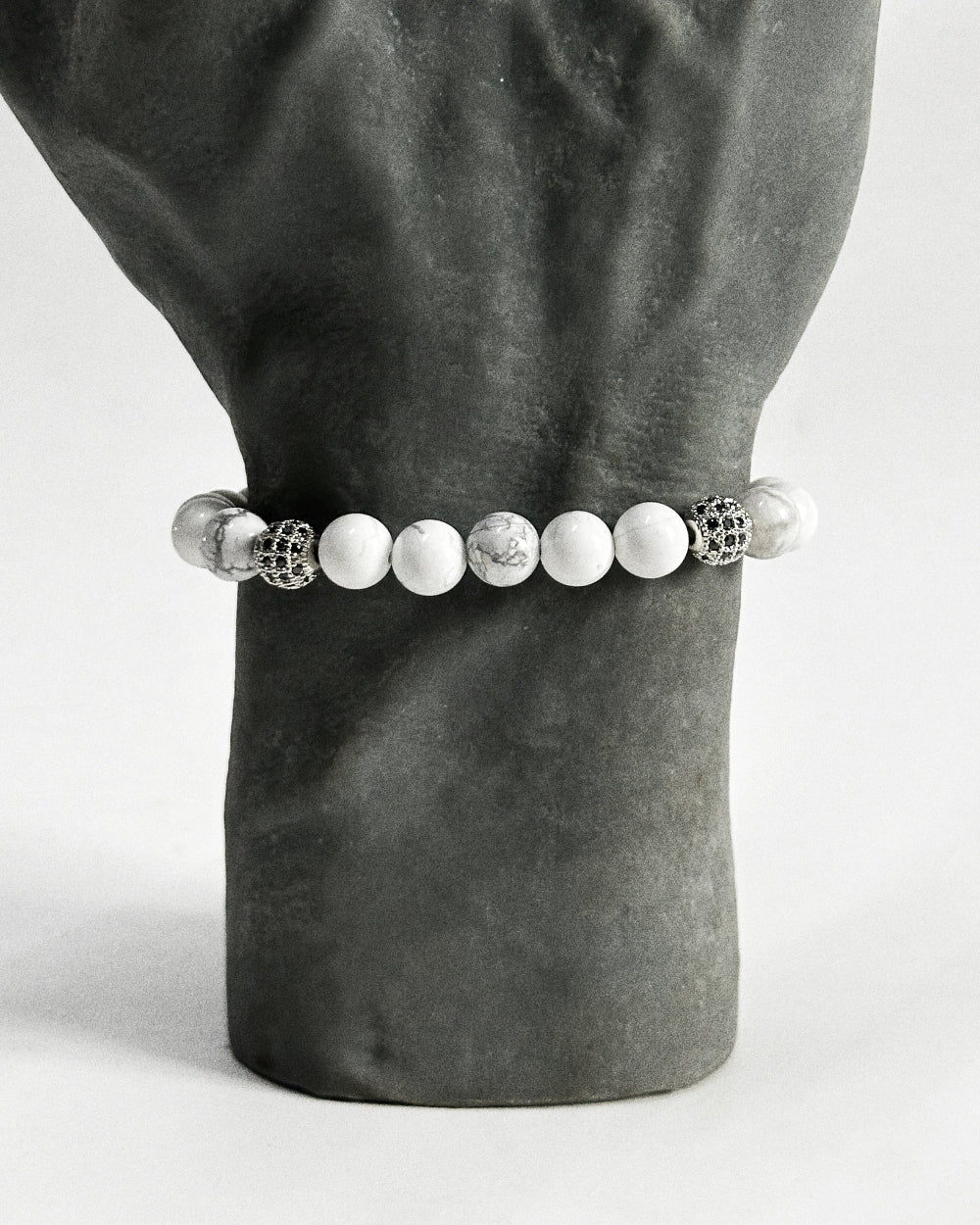 The CALLUM®️ Howlite Bracelet features natural semi-precious Howlite stones strung with Cubic Zirconia spacers in a silver finish. Strung in sturdy elastic for easy daily wear.