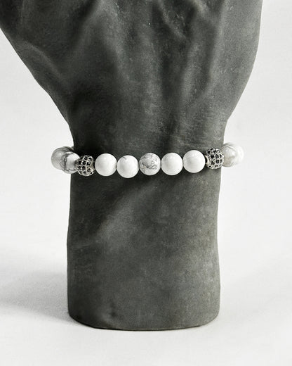 The CALLUM®️ Howlite Bracelet features natural semi-precious Howlite stones strung with Cubic Zirconia spacers in a silver finish. Strung in sturdy elastic for easy daily wear.