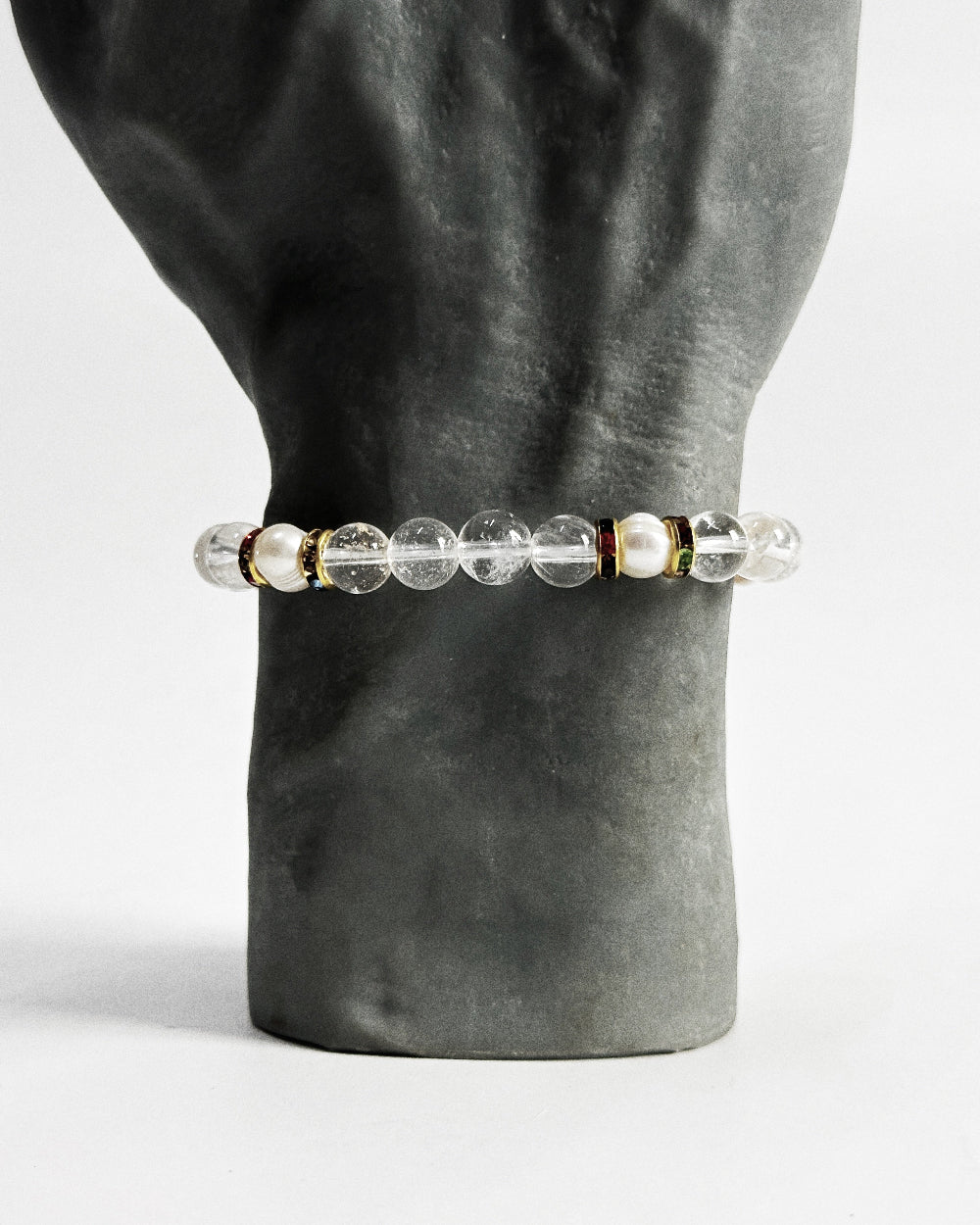 The STRATUS®️ Quartz and Pearl Bracelet features natural freshwater pearls and clear quartz strung with rhinestone-encrusted spacers in a yellow-gold finish.