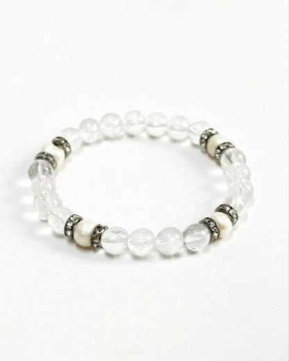 The CIRRUS®️ Quartz &amp; Pearl Bracelet features natural freshwater pearls and clear quartz strung with rhinestone-encrusted spacers in a gunmetal finish.