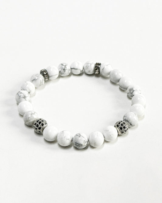 The CALLUM®️ Howlite Bracelet features natural semi-precious Howlite stones strung with Cubic Zirconia spacers in a silver finish. Strung in sturdy elastic for easy daily wear.