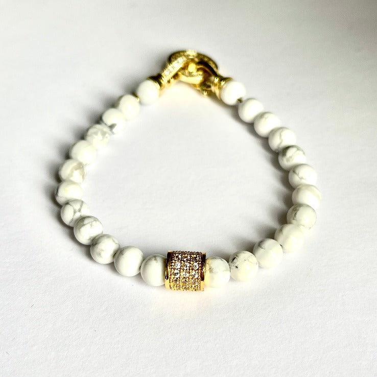 Handmade bead bracelet by Cold Gold Philippines. Features an Iced Out Gold spacer bead and genuine white howlite stones. It comes with the CG Infinity Lock for a secure fit.