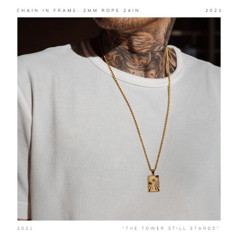 The Tower medallion represents the vision and strength necessary to see through adversity and remain defiant against pressure and the overwhelming odds.  The piece features an eye attached to the turret of a tower, struck by lightning.  It rests on the ground marked with the words “STILL STANDING” along with the official Cold Gold logo."