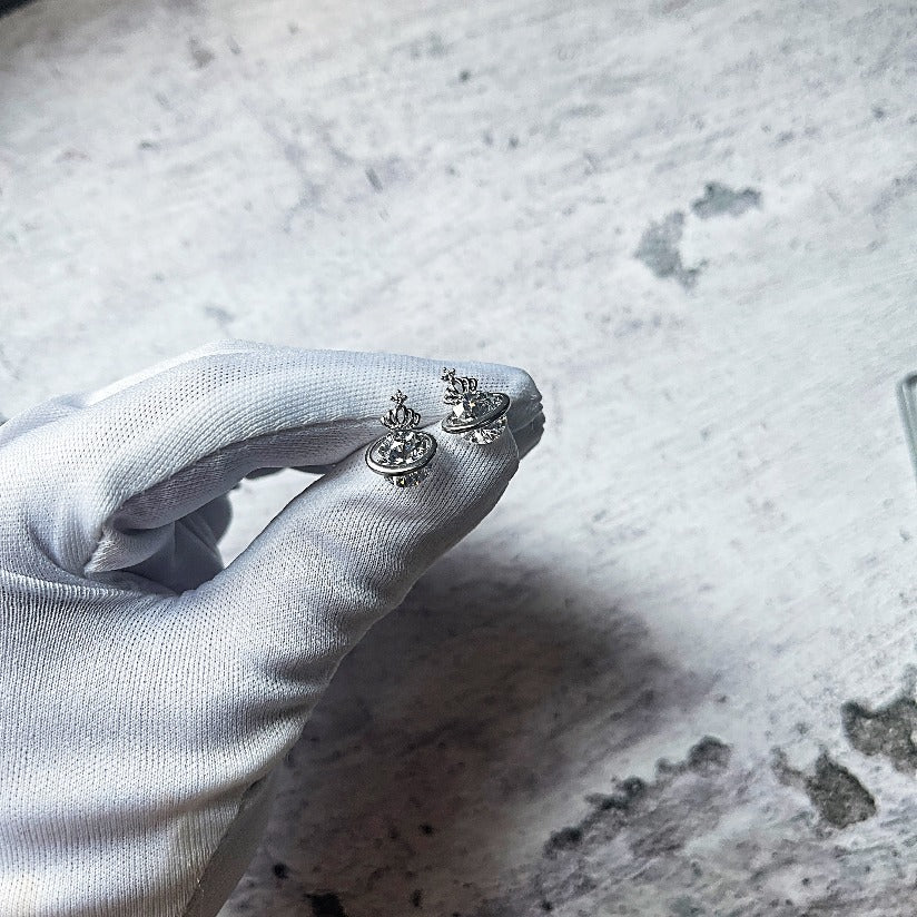 Viviene Westwood Inspired Stud Earrings. Features a rotating Cubic Zirconia Stone with a halo and crown.