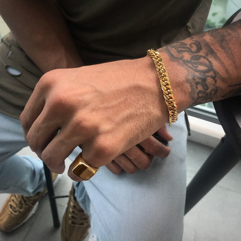 coldgold.co signet ring and cuban bracelet men's gold jewelry featuring sol mercado